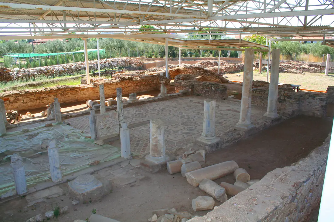 Excavation of the early Christian basilica of Sophronios, with column stumps and mosaic floor under a shelter